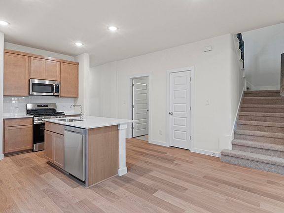 Kitchen in the Pearl home plan by Trophy Signature Homes - REPRESENTATIVE PHOTO