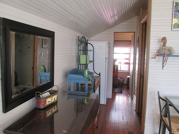 view into kitchen, bathroom, linens and towels