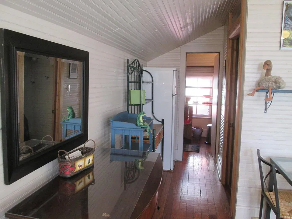 view into kitchen, bathroom, linens and towels
