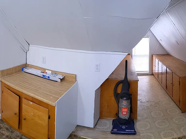 Third floor, office/playroom with a convenient half bathroom