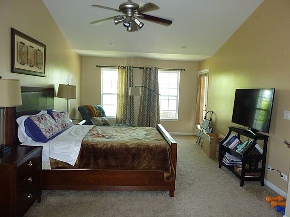 Huge Master Bedroom, vaulted ceiling, fan, large sitting area and door to Balcony!