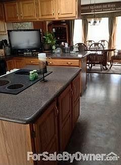 Living Room
						:
						Cathedral beamed ceiling, eyebrow window, gas fireplace with marble tile