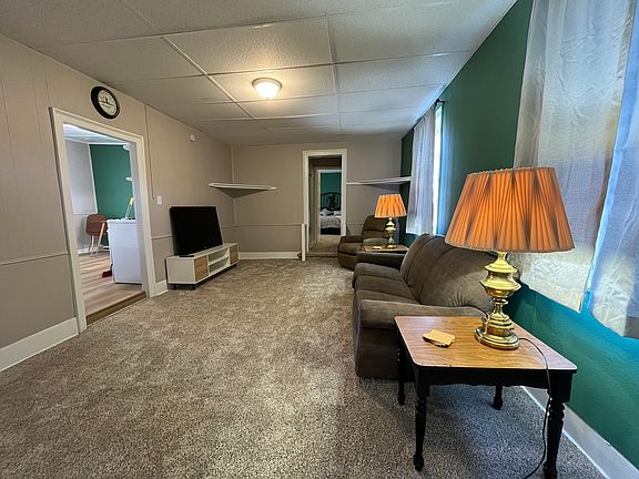 Living room looking from the bonus room to the master bedroom straight ahead and the kitchen to the left.