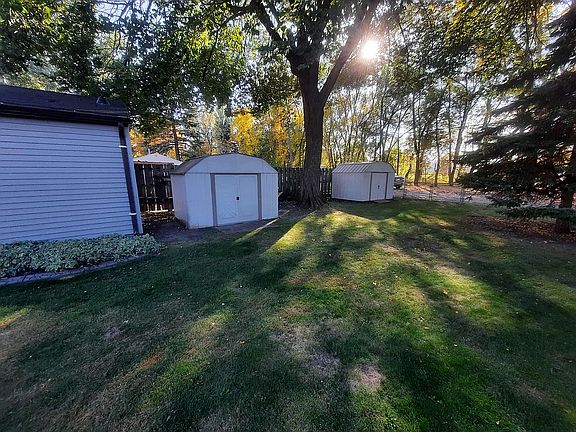 Back yard with storage sheds