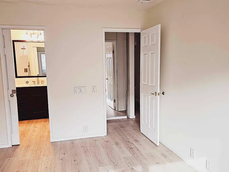 Master bedroom. Closet in the lobby. Entrance to master bath suite