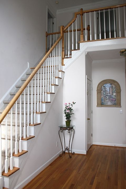 2-story foyer w/ hardwood floors opens to formal living room & great room