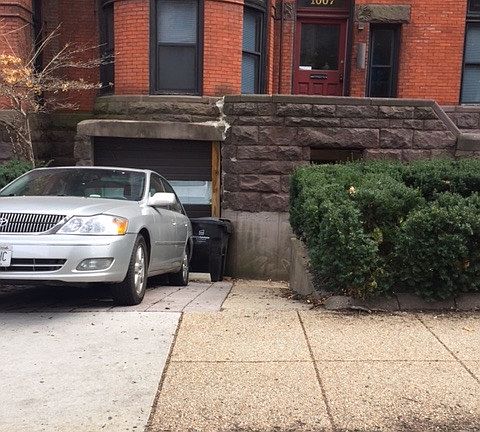 At end of driveway is entrance to unit