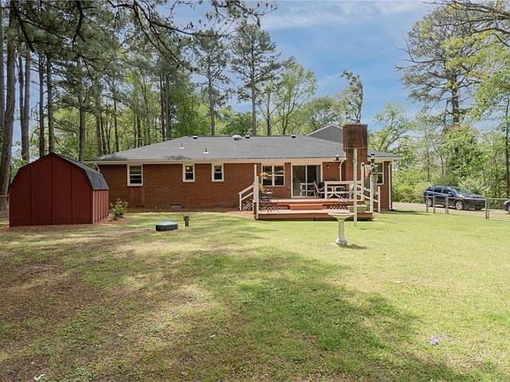 Huge fenced backyard with nice deck.
