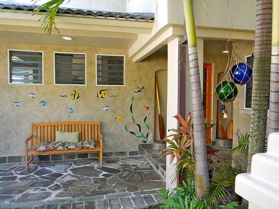 Lots of cool Quartzite floors, stucco exterior with stained glass and Island style details.