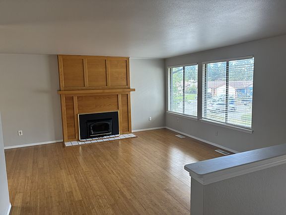 Living room with view of it's cozy wood stove!