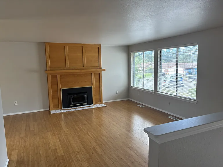Living room with view of it's cozy wood stove!