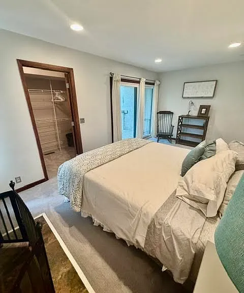 Second Story Primary Bedroom with Queen Plus Bed, Walk-In Closet, balcony and Gas Fireplace.