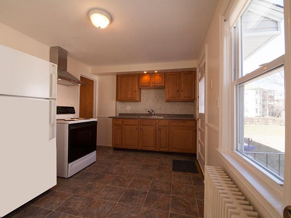 Modern Kitchen with vented exhaust hood over stove.