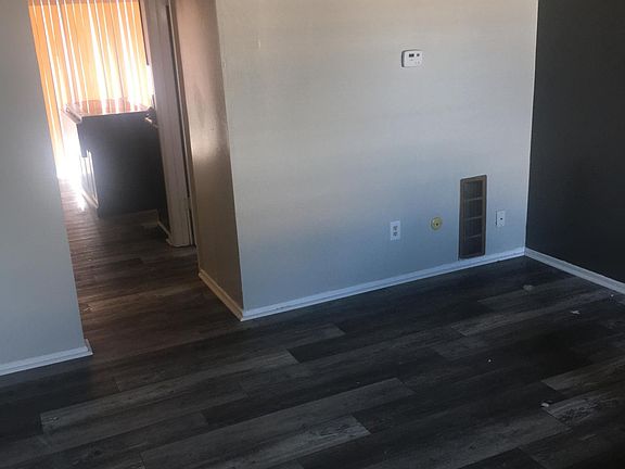 Back of living room towards kitchen and patio