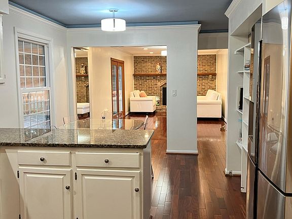 Kitchen lookout to playroom area/family room and breakfast table.