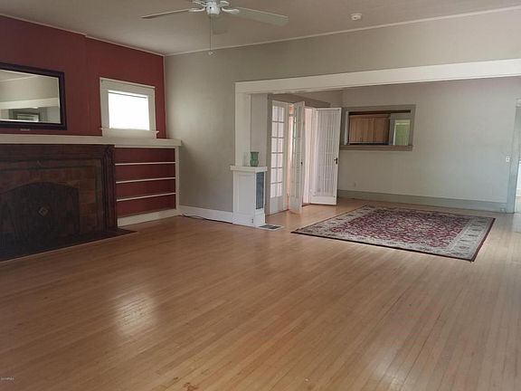 Living Room view towards Dining Room and pass-through window to kitchen