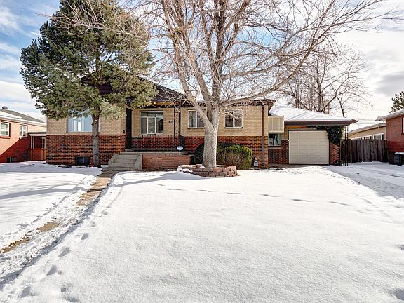 Front of house faces West. Nice yard with mature trees. Oversized attached garage with large workbench area and additional off-street parking on driveway.