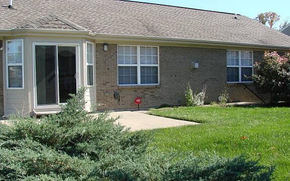 Back of house with patio and walkout