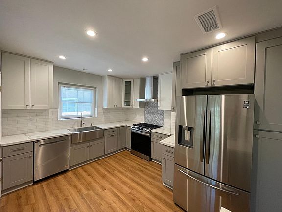 All new appliances! Brand new dishwasher, stove, range hood, and French doors refrigerator. New flooring to match the rest of the house, and brand new cabinets, countertops, faucet and sink.