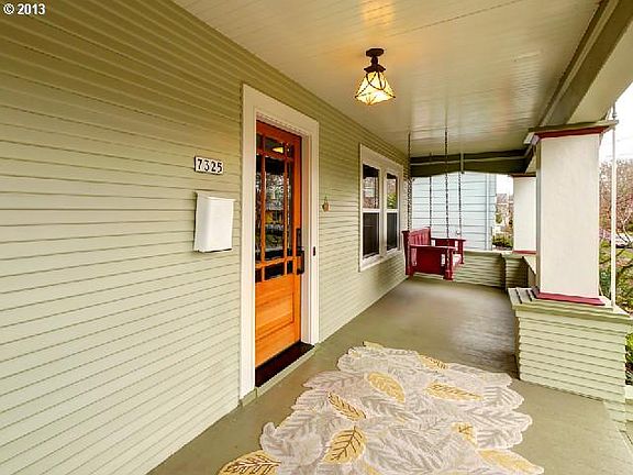 front porch with swing.
