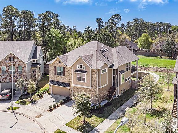 This quick aerial view shows the stairs leading to the front door, a balcony with views and a fenced in backyard!