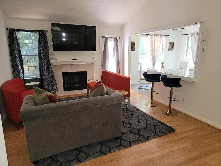 upgraded modern living room, 65in tv
couches and bar stools