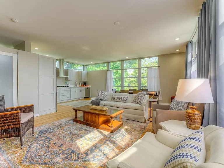 Open living area with lots of natural light, privacy curtains with blackout included