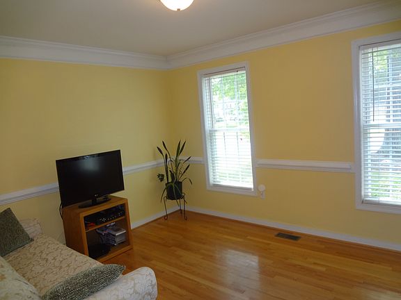 NEW PAINT!  Chair railing, crown moulding & hardwoods add an elegant touch 