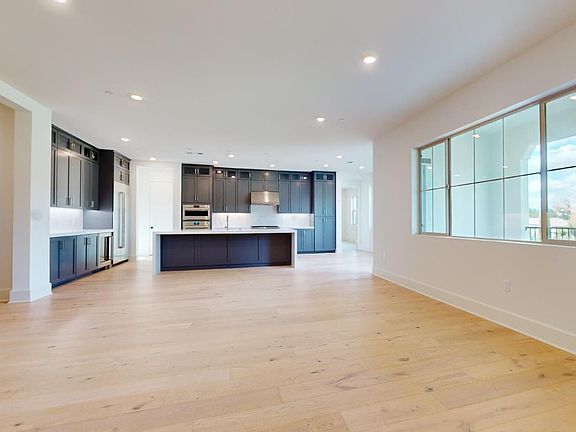 This image showcases the Great Room and Kitchen in Villas Homesite 12, Unit 320.