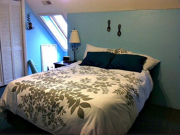 Upstairs bedrooms have skylights and ceiling fans.