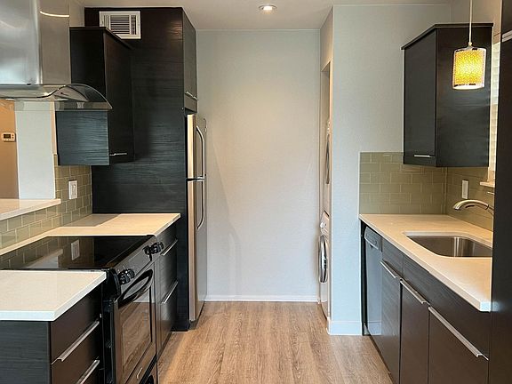 Includes dishwasher, full sized fridge, built-in electric stovetop & oven