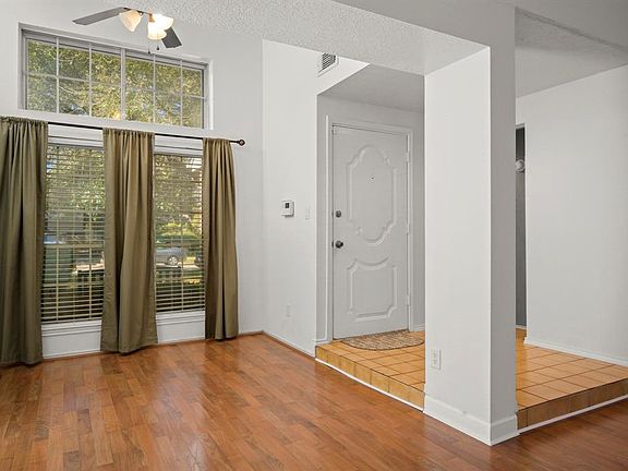 Warm wood laminate floors and neutral paint colors!