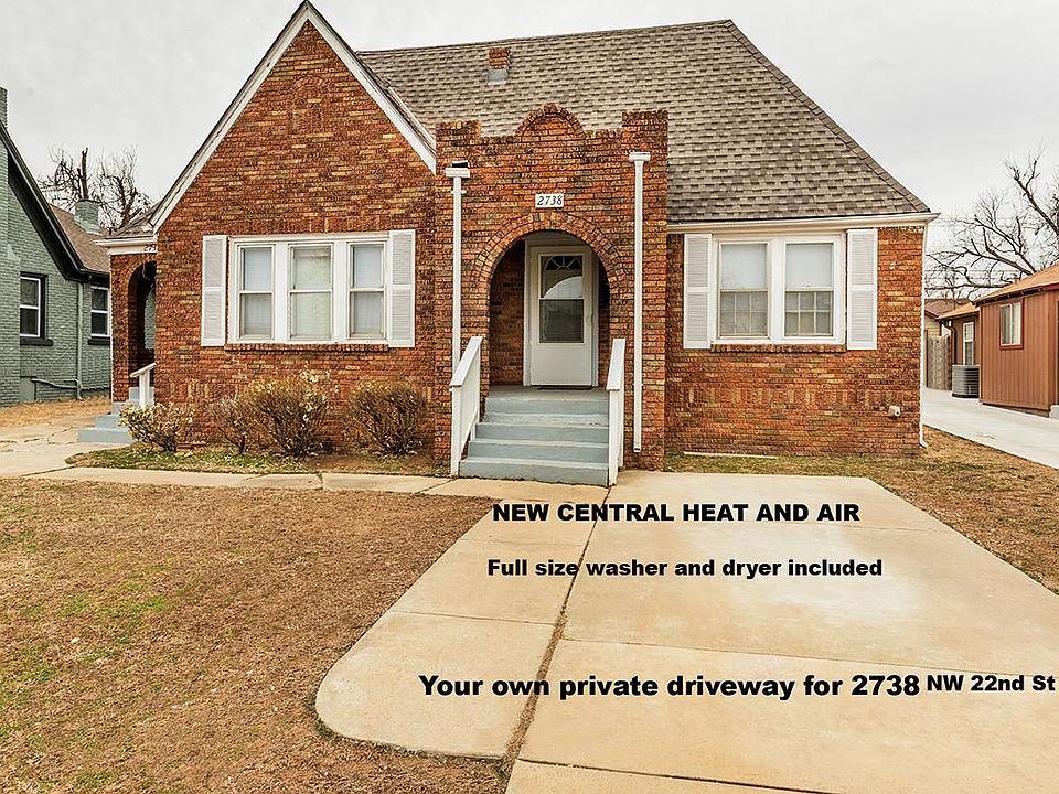 Front view of this large 989 SF duplex. Your own private driveway parking for this side!