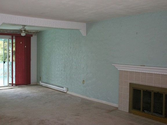 Adjacent to the living room is the dining area with sliding doors leading to the oversized deck.