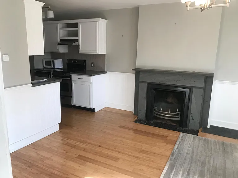 Living Room with Ornamental Fireplace