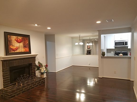 Open floor plan connecting living room to dining room and ki
