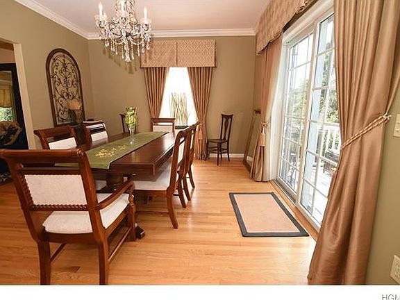 Crown molding accents this sun filled dining room.
