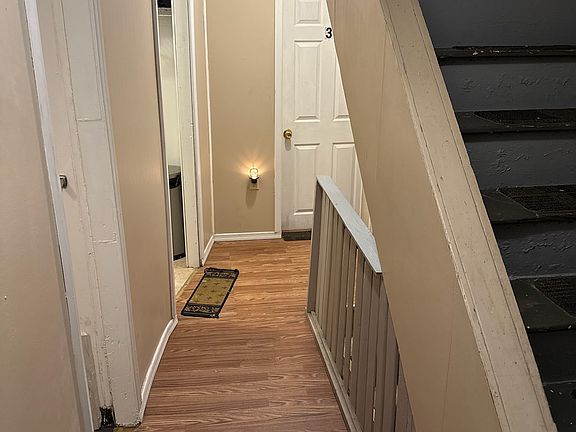 Second floor hallway to other bedrooms, bathroom and the laundry room. Brand new hardwood lament flooring.