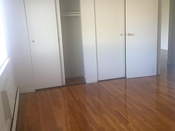 King sized bedroom with wall of closets