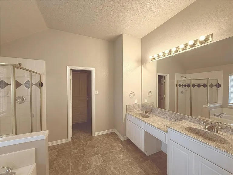 MASTER BATHROOM WITH HIS AND HER VANITIES, SHOWER AND SOAKING TUB