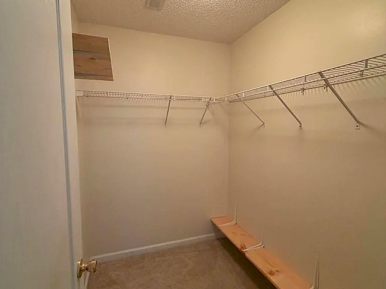 Walk-in closet with added shelving