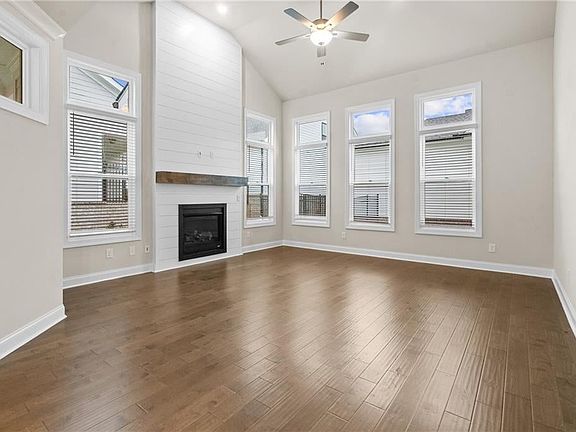 The McIntosh has striking ceiling height which allows for amazing light! Photo is not of actual home