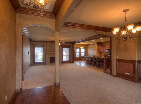 Looking from the entry area into the living, kitchen on the right.