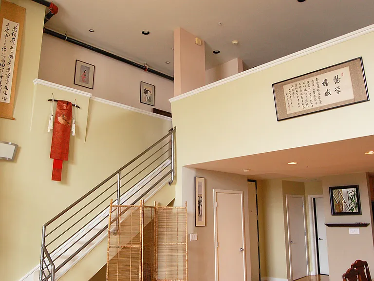 Stairs to bedroom. Storage under stairs and downstairs closet.