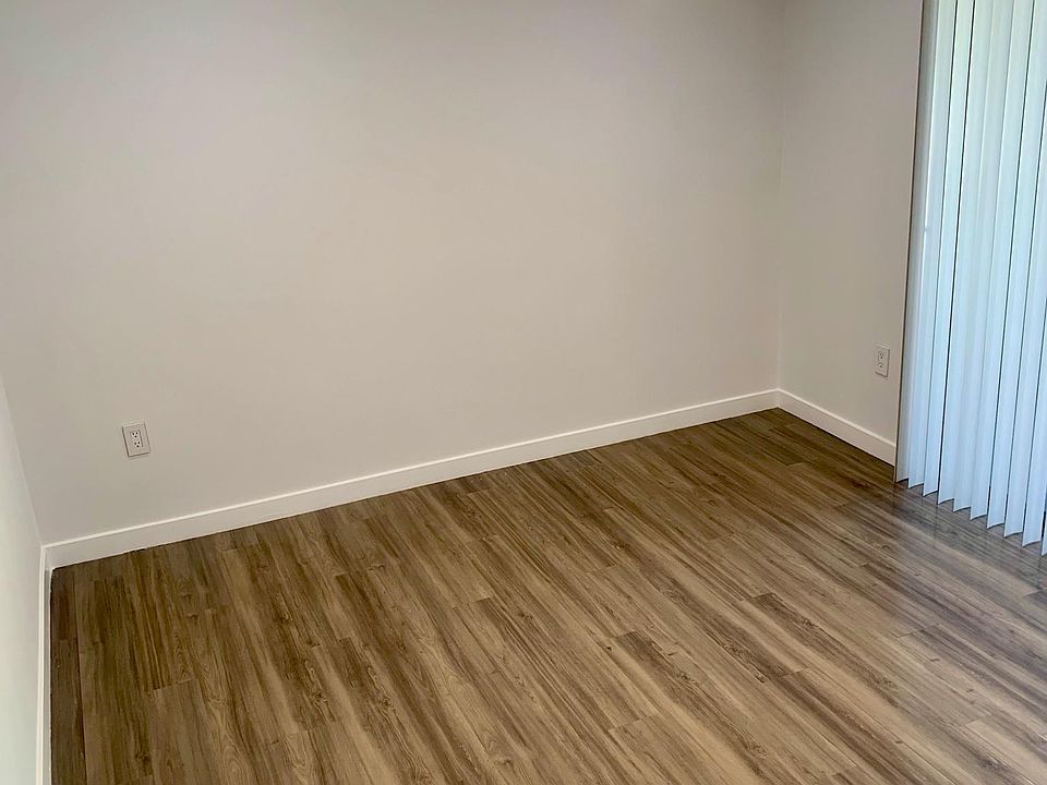 Large Bedroom with Hardwood and Private Balcony