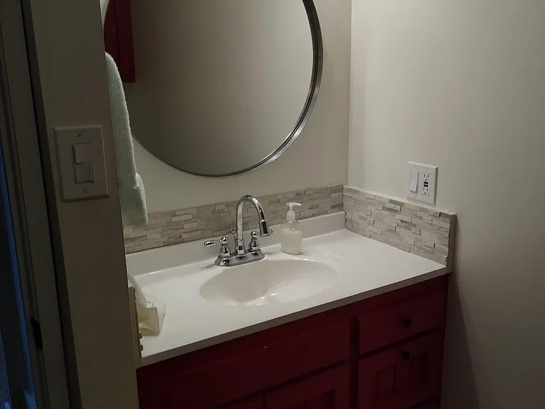 Small bathroom adjacent to living area