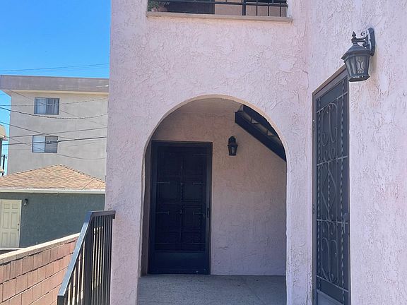 Closer view of walkway to front door of apartment