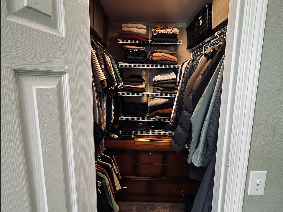 Walk-in closet with built-in shelving and storage