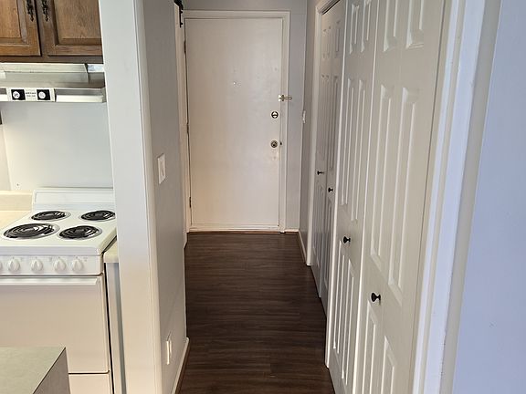 Entryway has lots of well-lit closet space.