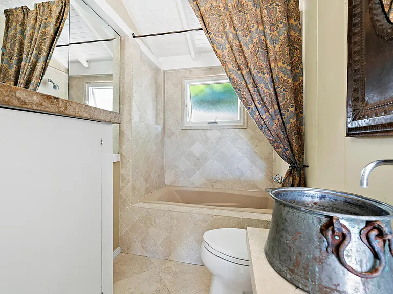 Tumbled marble & limestone bath